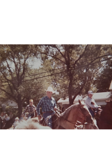 Grandpa Smith riding Deck in the Wills Rogers Rodeo Parade that the family rode in every year.