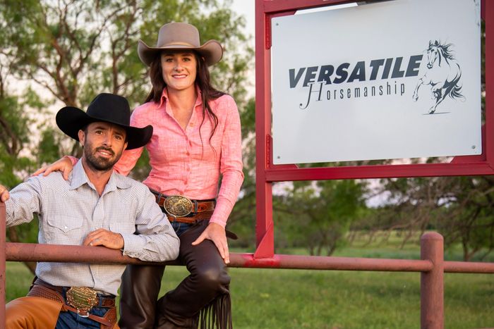 Horse trainers and clinicians sitting on a fence.