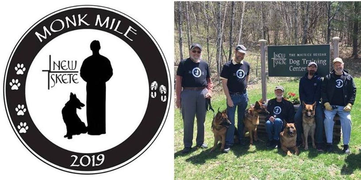 Monk mile logo and Monks with their German Shepherd dogs standing next to the dog training sign