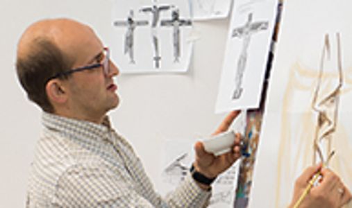 philip davydov painting an icon of Christ on cross