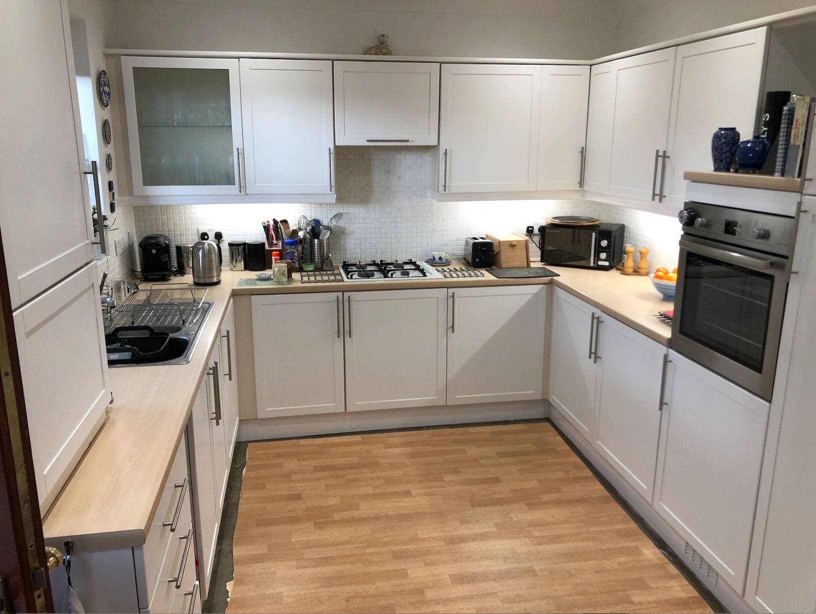 Kitchen Doors and Drawers removed, refurbished and re-sprayed with a hard wearing Matt White