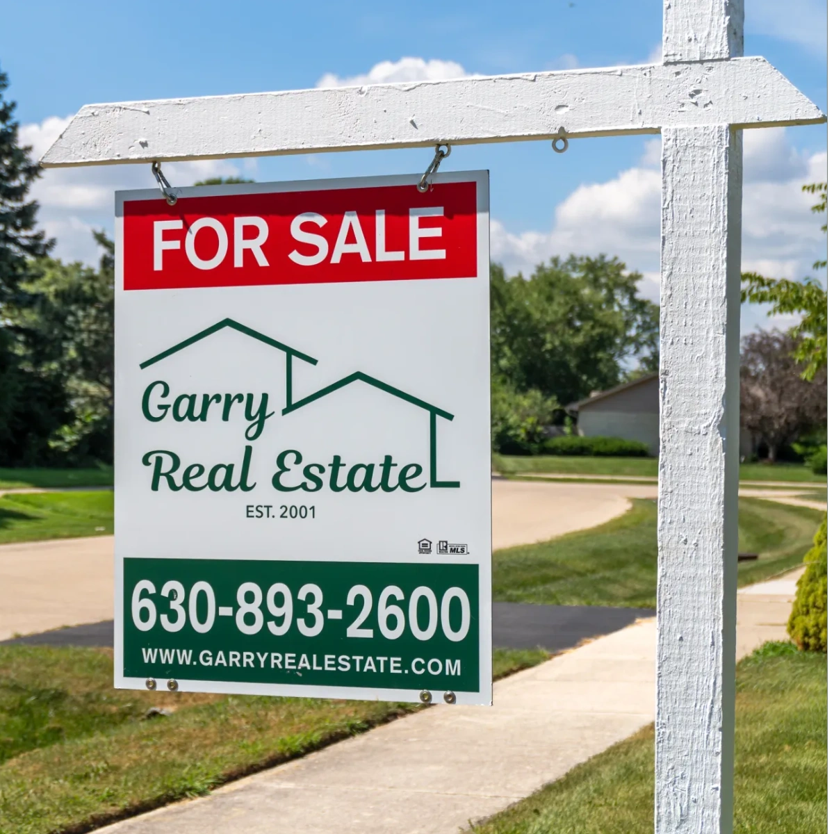 Garry Real Estate for sale sign outside a home in Roselle, Illinois.