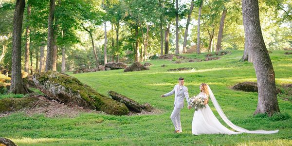 bride and groom taking bridal portraits outdoors