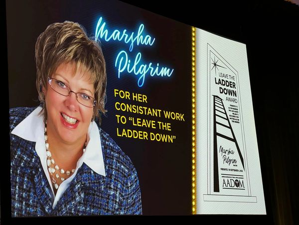 Marsha Pilgrim honored for consistent work on the "Leave the Ladder Down" award.