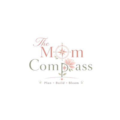 A delicate logo with a compass and flower, reading 'The Mom Compass'.