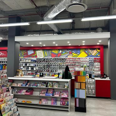 Modern stationery store with colorful displays and organized shelves.