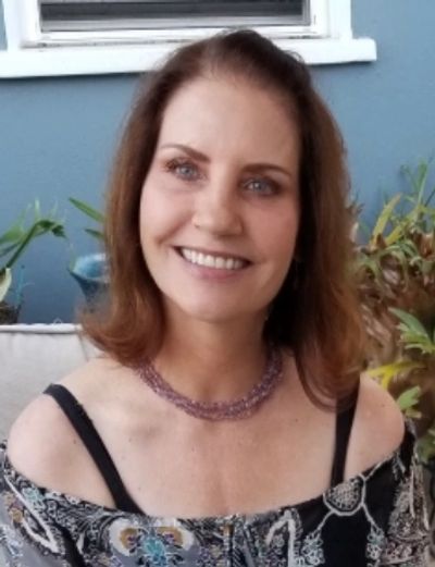 Meet Claire, the highly skilled Quantum Healing Hypnosis Technique Practitioner smiling at you with