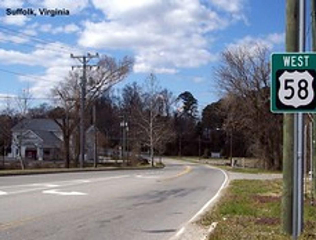 Suffolk VA curving road with road sign saying 58 West.