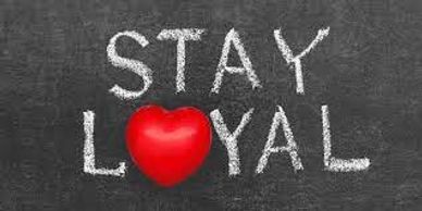 The words loyal written on  a blackboard.