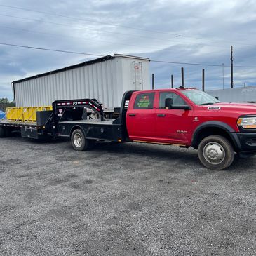 Ram 5500 transporting job site materials to new location 