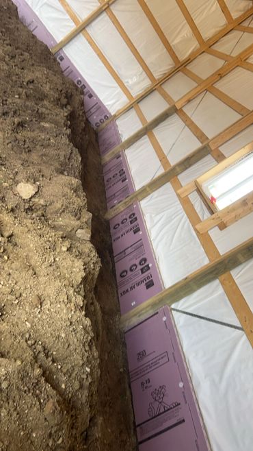 Foam board 2' underneath shop floor to improve efficiency of in floor heat