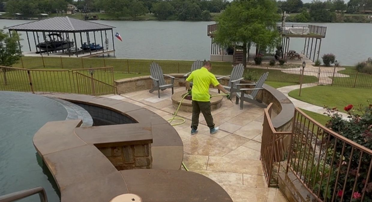 Soft washing a pool deck.