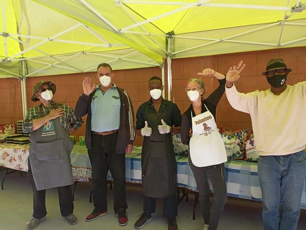 people in a convention wearing face masks