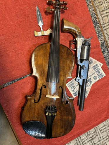 Old fiddle with worn strings