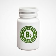 A white bottle with a green “Vitamin B2” label.