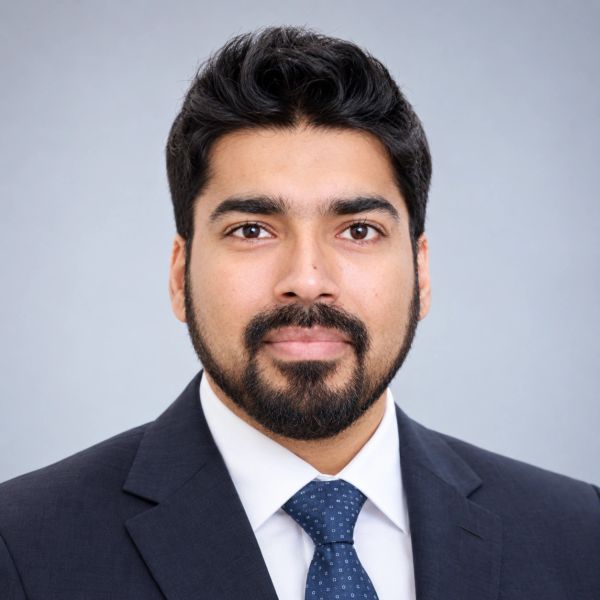 Professional portrait of a man in a suit and tie.
