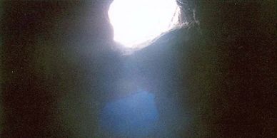 Another phot from Irv Wiswall inside the cave looking up through the hole.