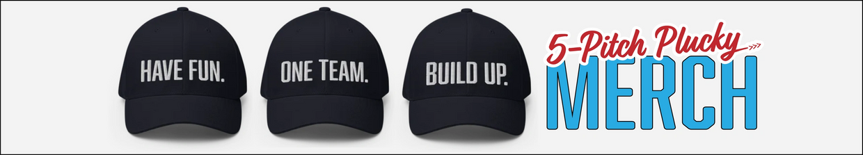These navy blue baseball caps say Have Fun. One Team. Build Up. and are designed to support community building.