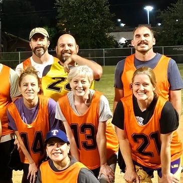 Group of male and female adults having great fun playing 5-Pitch Plucky, modified baseball for all
