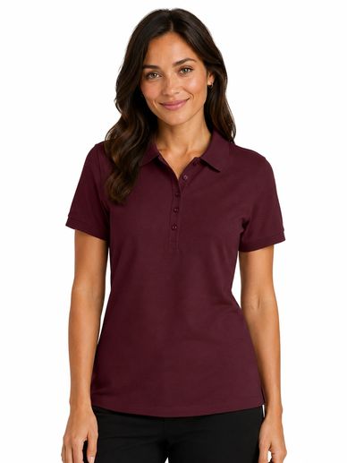 Woman wearing a maroon polo shirt and black pants, smiling at the camera.