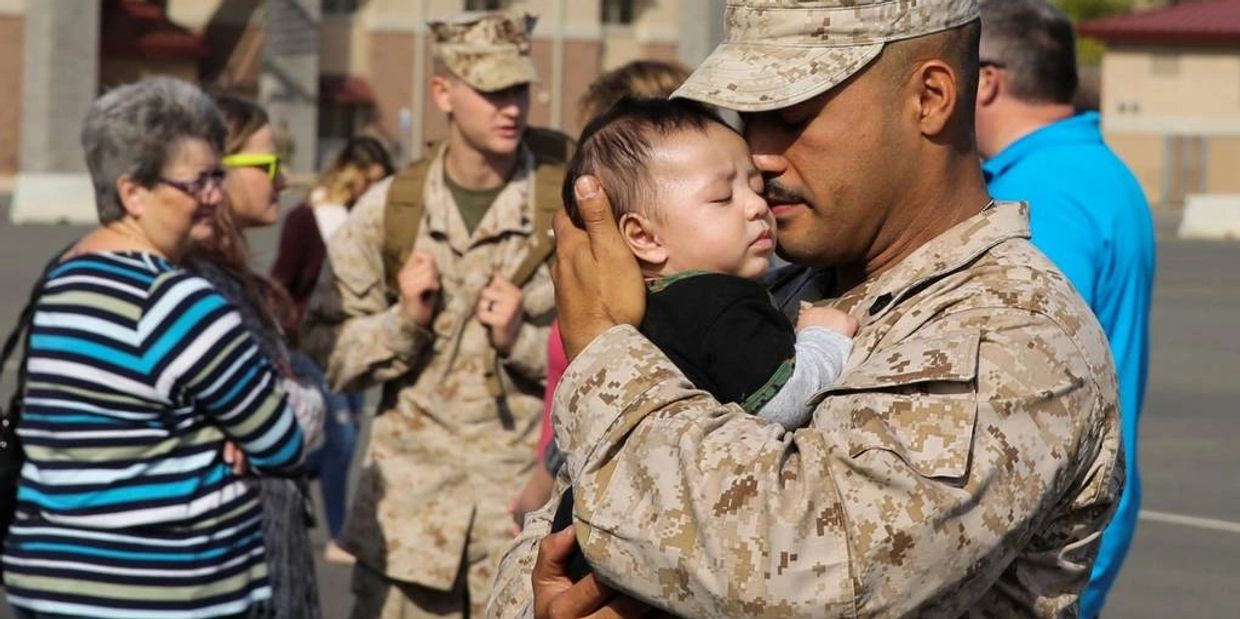 Returning military seeing loved ones upon their return.