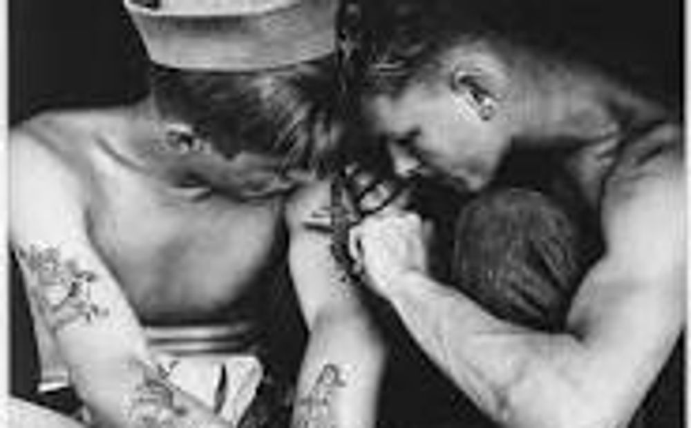 Much-tattooed sailor aboard the USS New Jersey, WWII. Photo US National Archives and Records