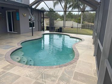 Poolside modern stone concrete deck