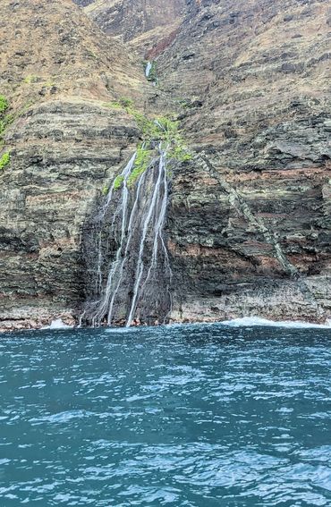 Split waterfall reaches the ocean