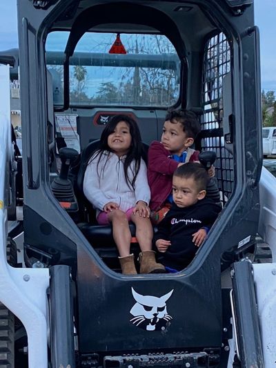 Owners children , Madelyn,Lucas, and Erza ready to operate the Bobcat T66 