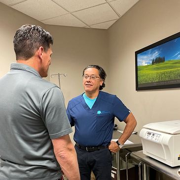 Dr Garcia with a patient at Enlite Clinics Headquarters in Columbus, Ohio