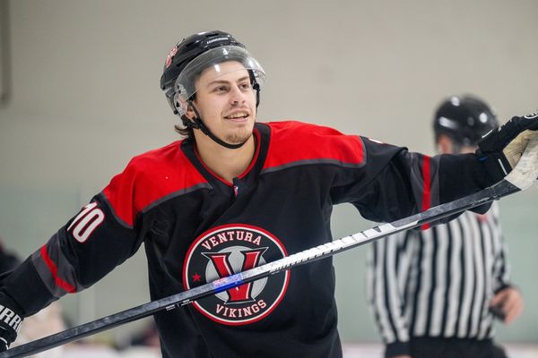Hockey player celebrating on the ice rink.