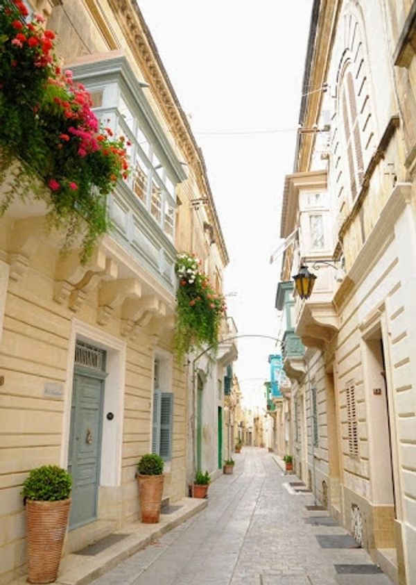 Streets of a local town with typical Maltese traditional homes.