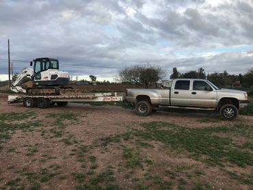 A car towing a small truck