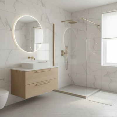 Modern bathroom with round illuminated mirror and glass shower area.