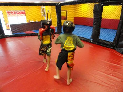 Two Dauntless MMA Kids sparring in the MMA Cage