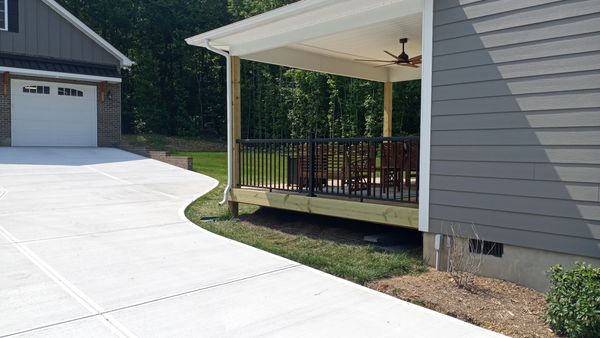 Black aluminum handrails added to existing deck by JTM Renovations in Oakboro, NC