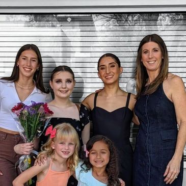 dance teachers just done performing in a photo with their students who are inspired by them.