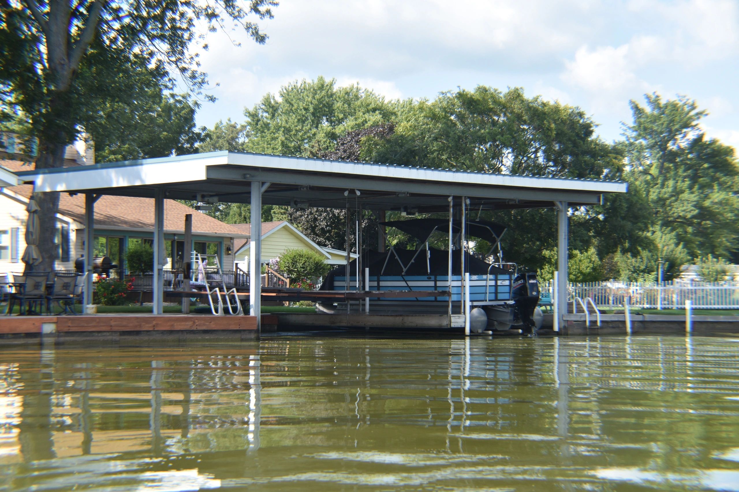 Custom built double boat dock with shelter.