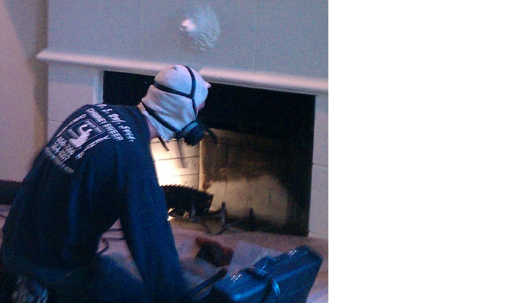 Master Sweep Sam cleaning a fireplace.
