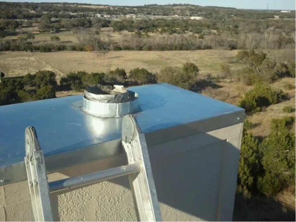 New chase covers installed on the chimney top.