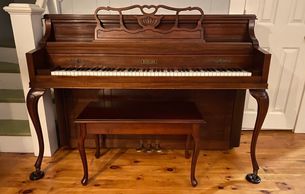 Console piano, cherry, with french provincial legs and matching bench after being delivered