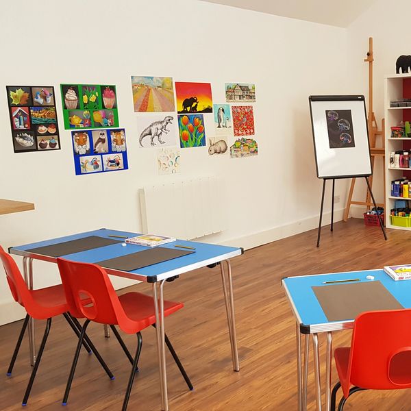 An art studio with desks and chairs