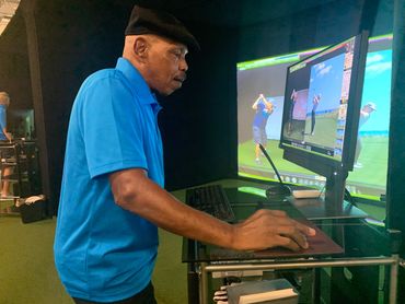 a man reviewing his golf swing