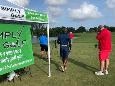 A view of the Simply Golf banner on the tent