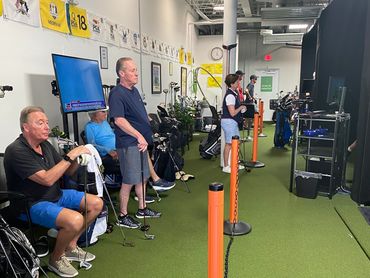 people waiting with the Golf clubs