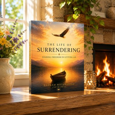 Book titled 'The Life of Surrendering' on a wooden mantle.