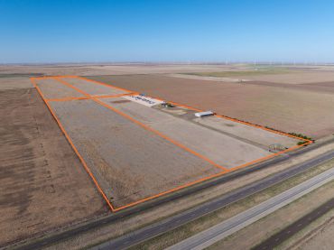 Aerial view of four land parcels for sale along Interstate 40 near Panhandle, Texas, with property boundary overlays.