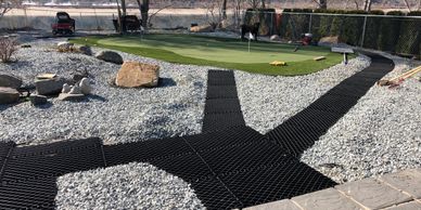 Placing Diamond Grid for pathway to the green and around the zero scaped yard.