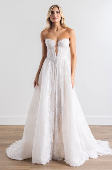 a two piece lace wedding dress with and basque waist and plunging neckline