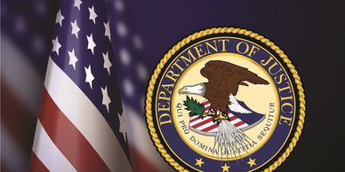 Seal of the U.S. Department of Justice with the American flag beside it.